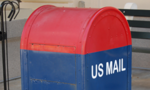 Red and blue mailox with the label "US MAIL"