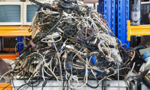 Lots of old electronic waste in a pile.