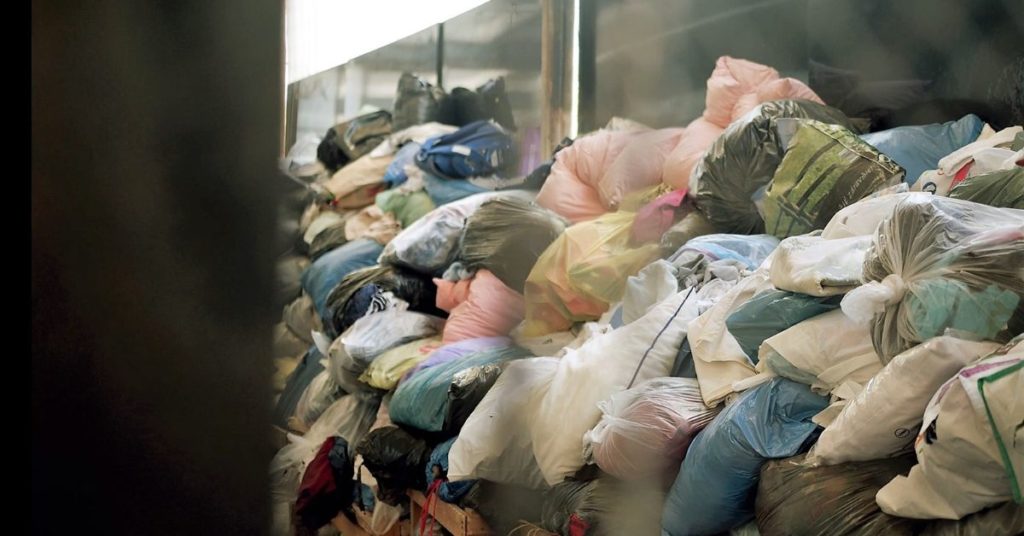 Bags of used textile in the pile. 
