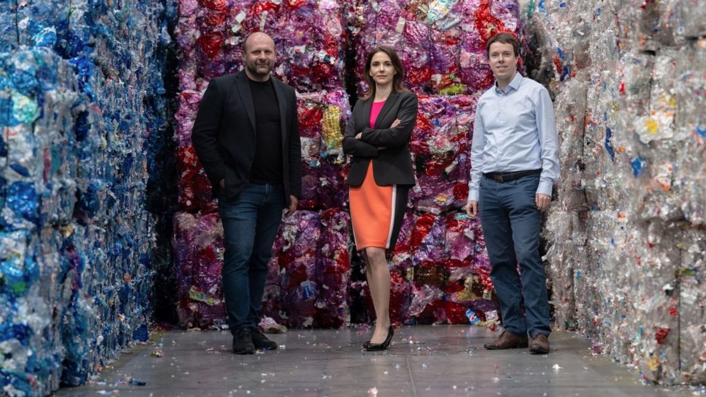 Martin Basila, Maria Trckova, and Peter Knaz at recycling facility. 