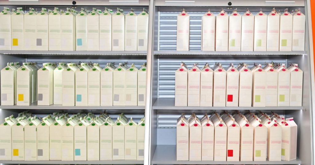 Cartons of milks placed in shelves.