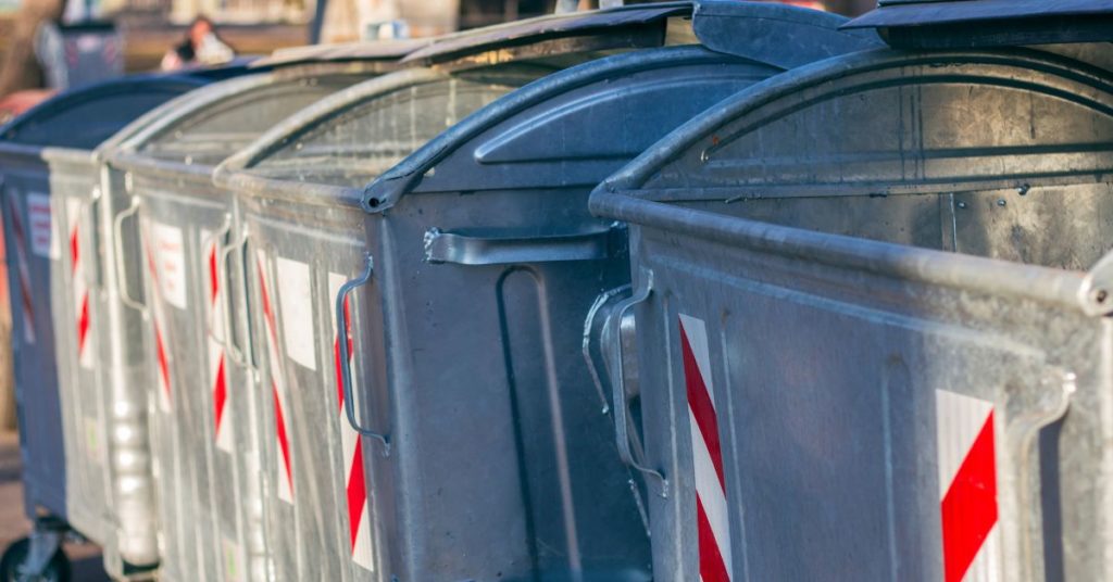 Galvanized steel waste containers on the street.