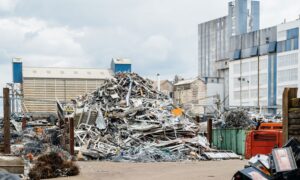 Metal scrap waste infront of a production factory.