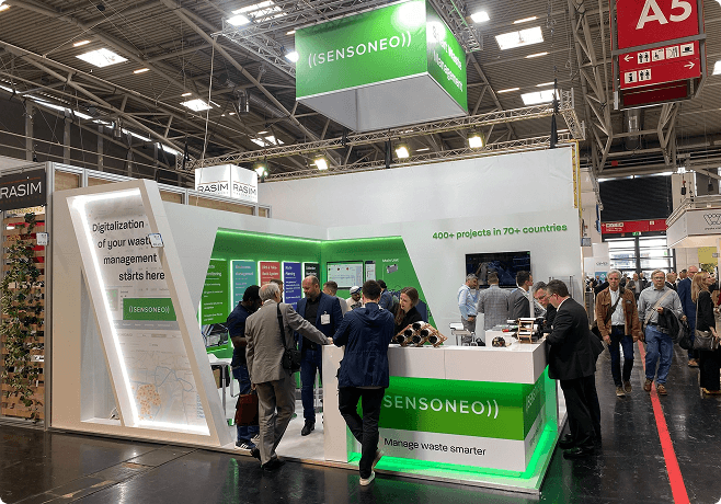 Sensoneo booth at an exhibition, showcasing waste management solutions.