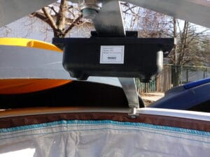 Close-up of a sensor mounted on a waste container, labeled with a "Brain-It" tag.