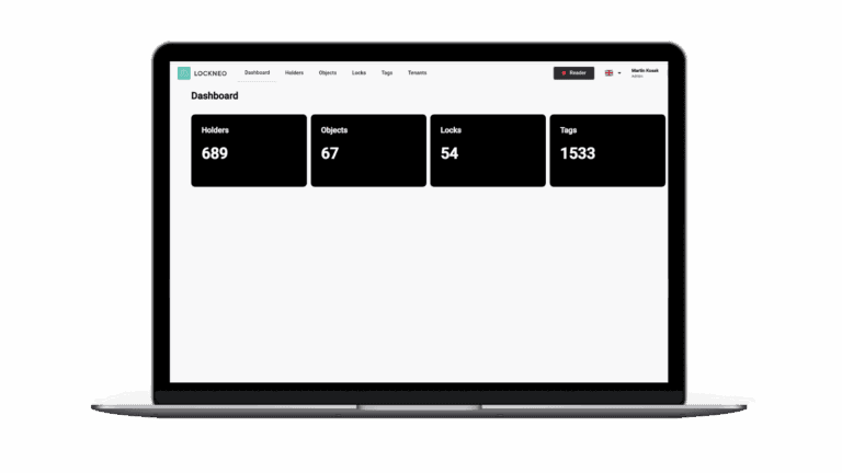 Laptop displaying a dashboard with statistics for holders, objects, locks, and tags.

