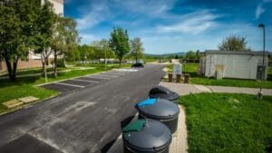 Smart underground waste bins in a public area for cleaner surroundings and efficient collection.