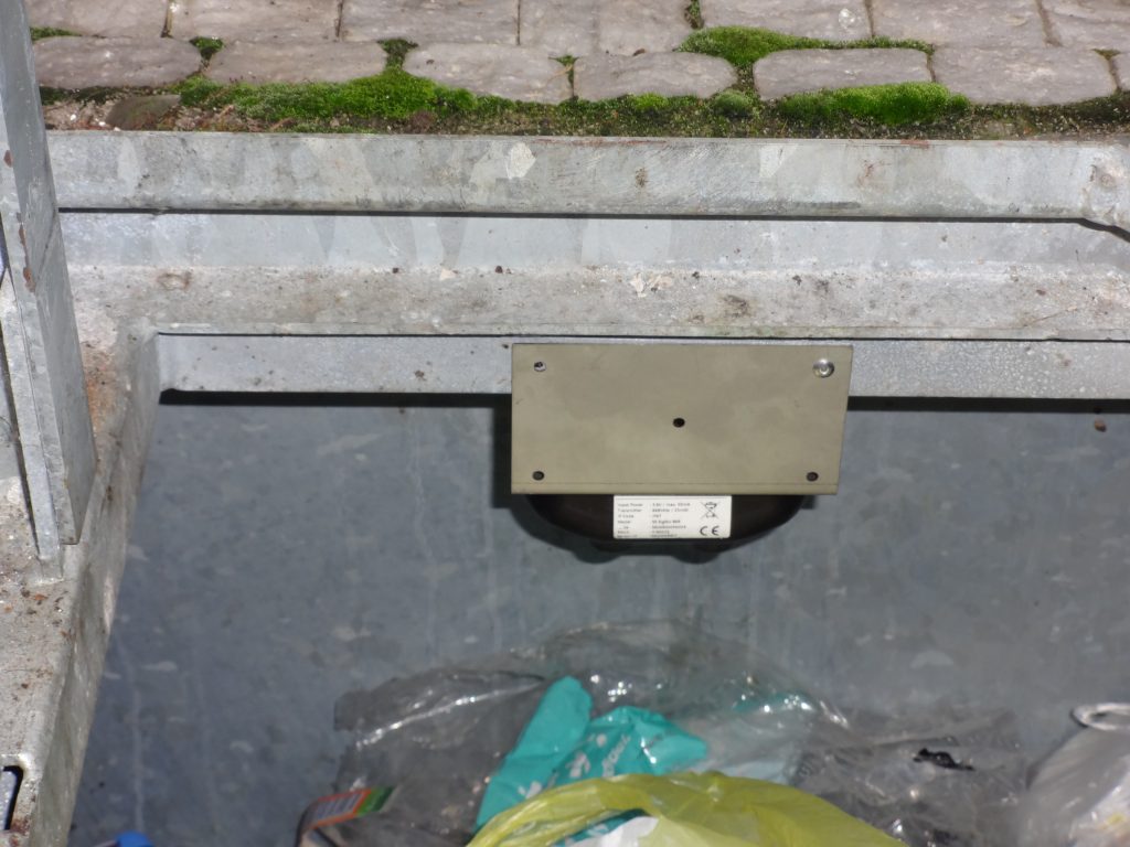Fill-level monitoring sensor inside the underground bin.